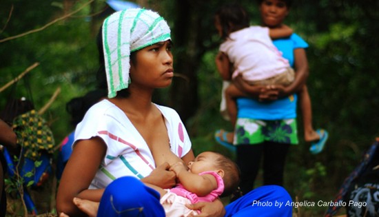 A Dumagat woman breastfeeds her six-month-old baby